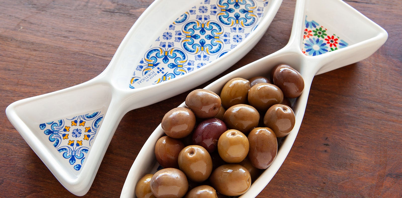Sourced locally and directly from real artisans, at We Are Portugal you will find olive serving dishes with pit holder in various colors and shapes.