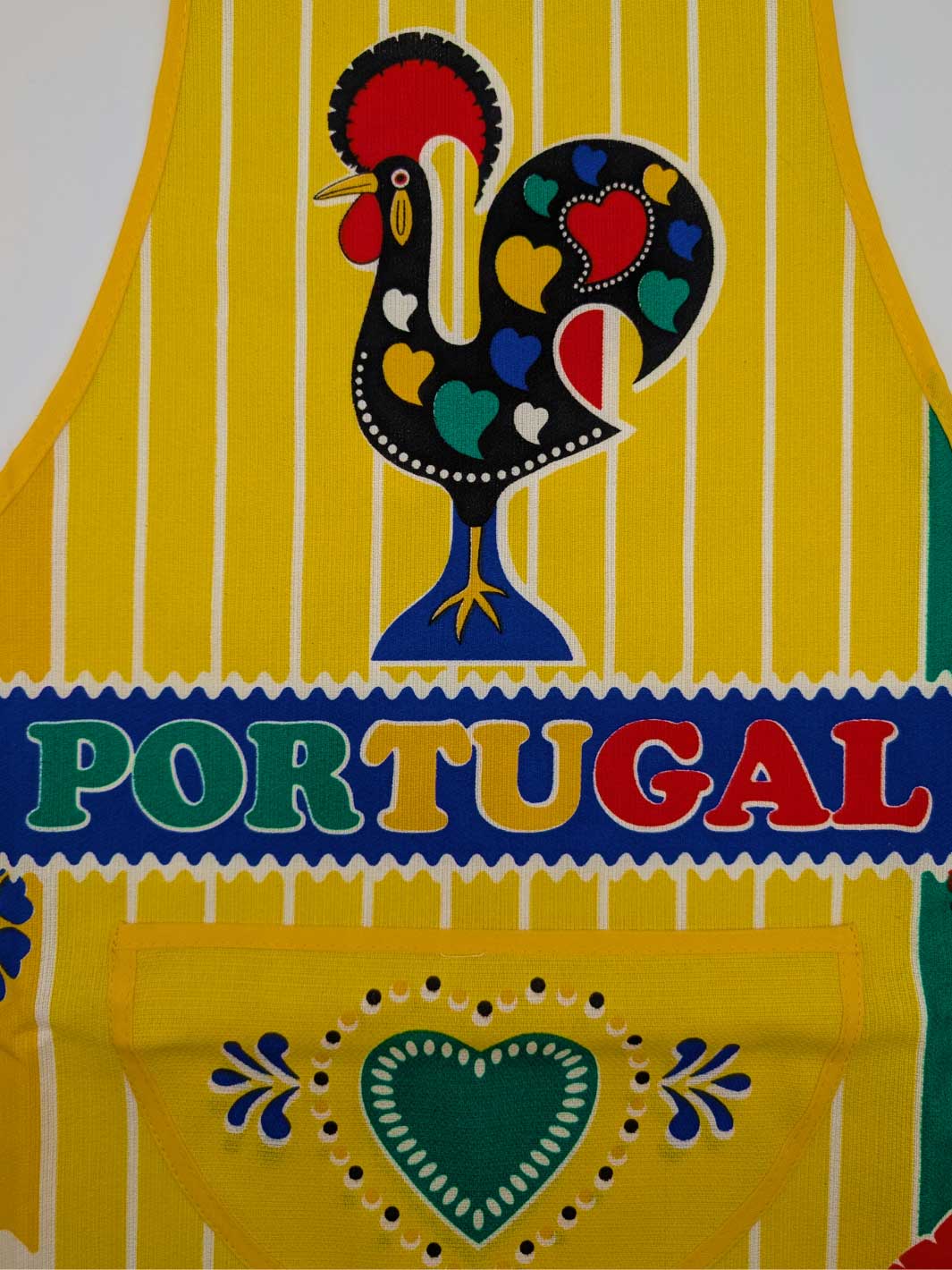 Yellow apron with a colorful rooster design and 'Portugal' text on a white background