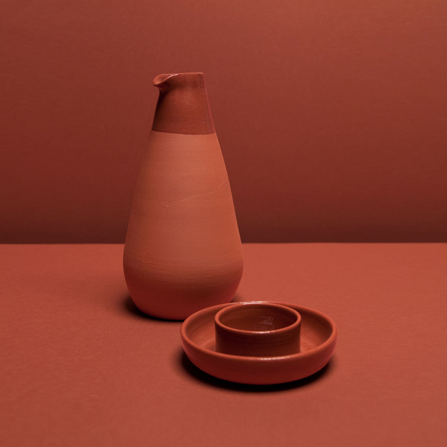 Bajouca pitcher and olive dish are terracotta pieces designed by Luis Nascimento for Tasco collection by Vicara
