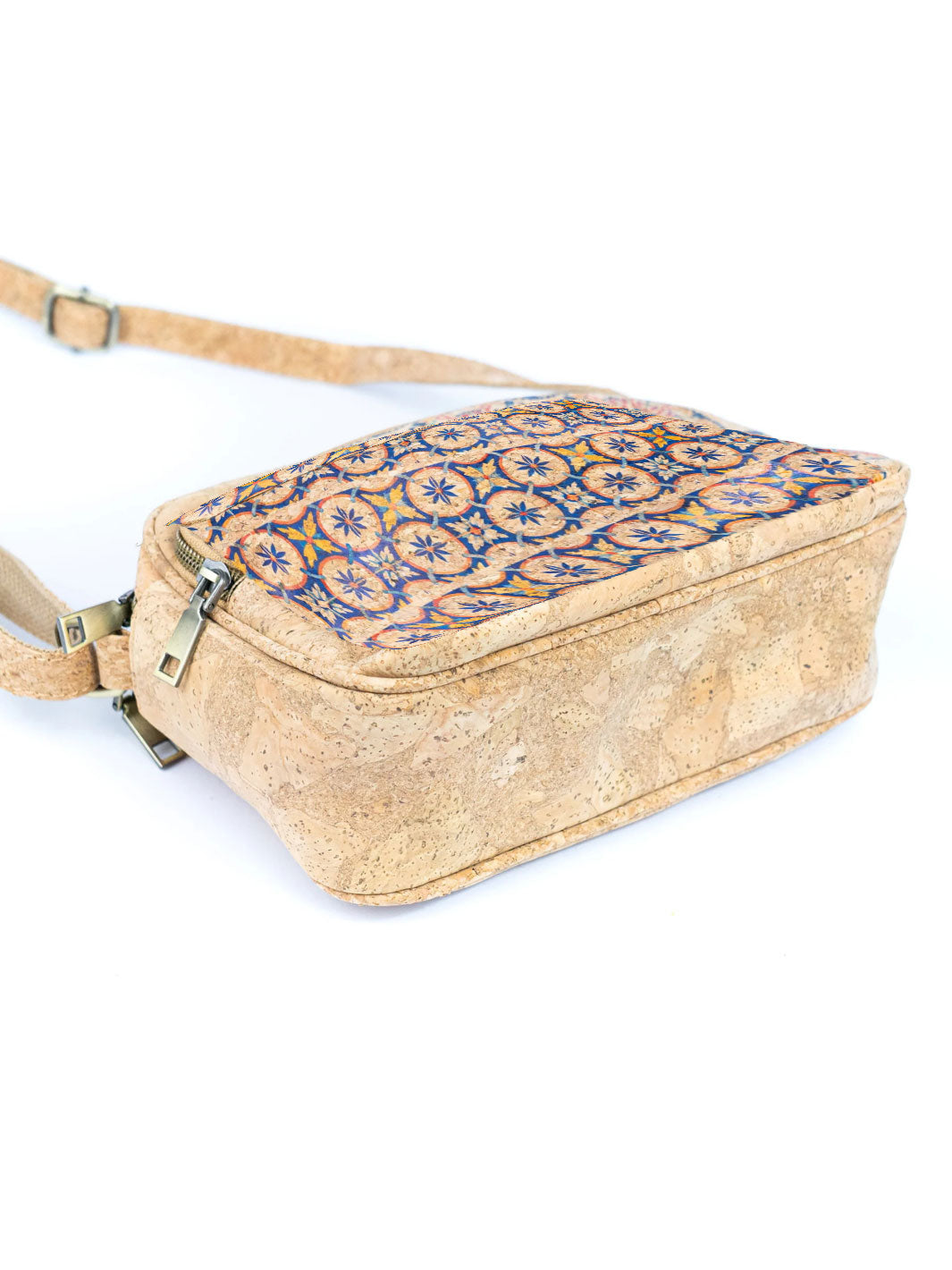 Cork crossbody bag with blue floral pattern on a white background