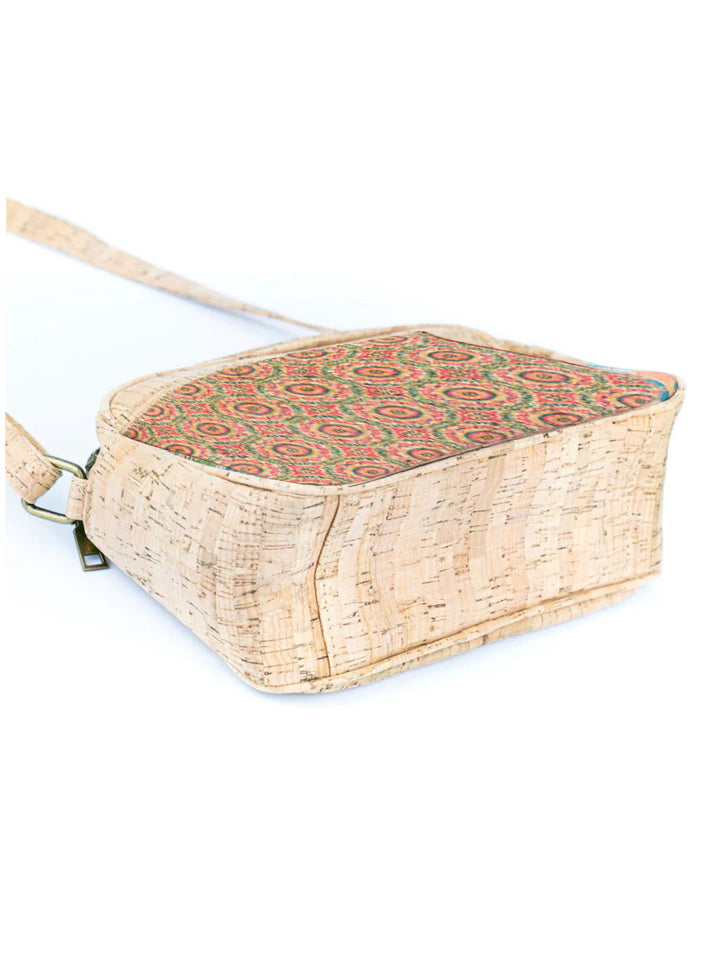 Woven bag with a patterned top section on a white background
