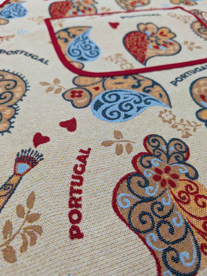 Decorative rug with Portuguese design featuring hearts and floral patterns.