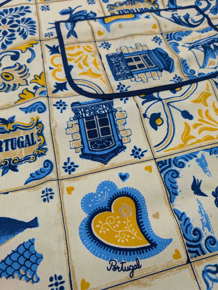 Close-up of Portuguese tiles with blue and yellow design, featuring the word 'Portugal'.