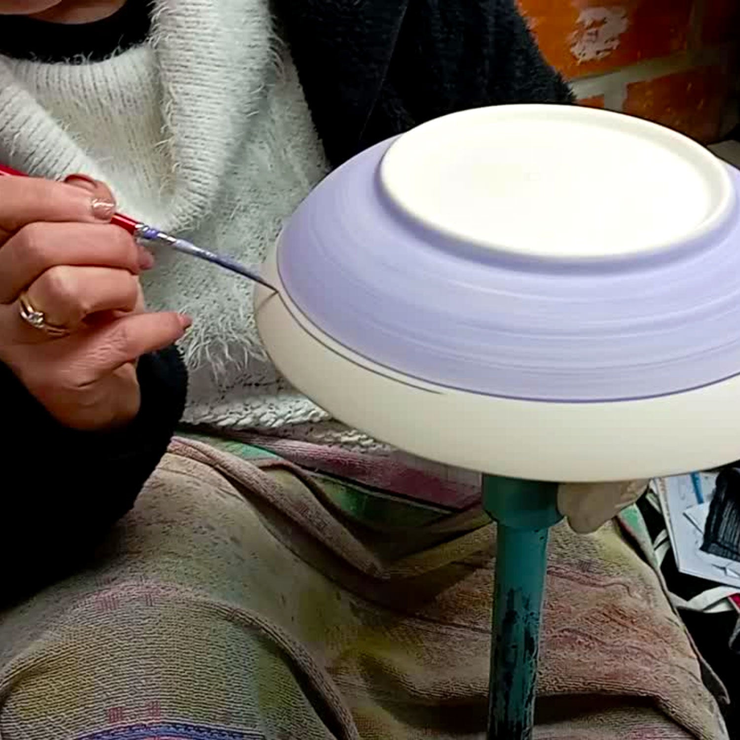 Portuguese artisans painting traditional ceramics by hand