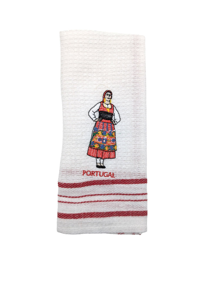 White towel with embroidered design of a person in traditional Portuguese dress and 'Portugal' text on a white background.