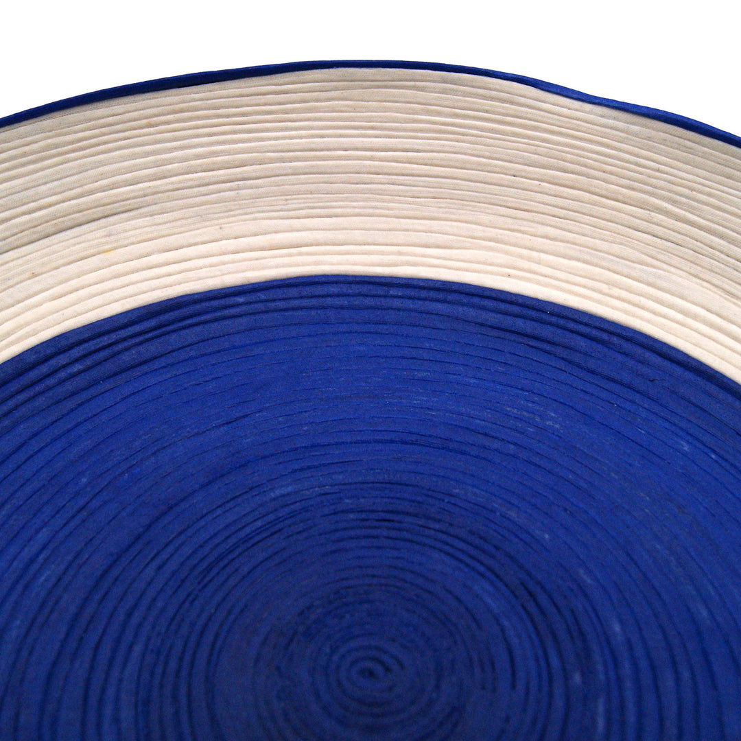 This handmade woven centerpiece is Developed through a sustainable process that hardens the fabric, making the pieces durable and sturdy.