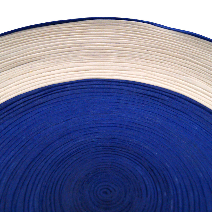 This handmade woven centerpiece is Developed through a sustainable process that hardens the fabric, making the pieces durable and sturdy.