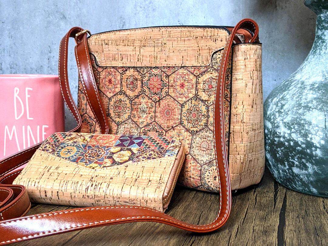 Handmade natural portuguese cork purse and wallet in a table near a flower vase and a candle.