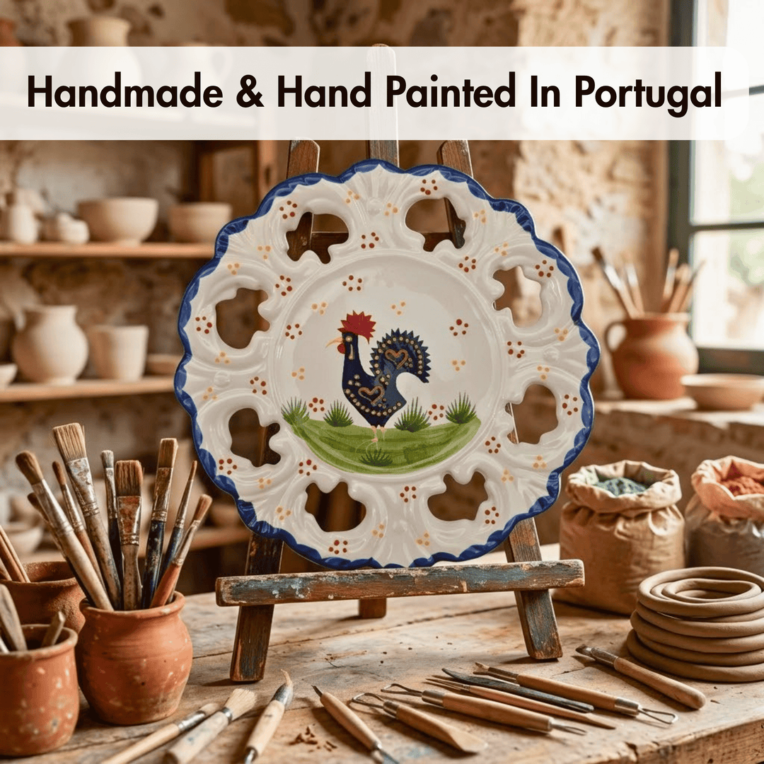 Handmade ceramic plate with rooster design on an easel, surrounded by pottery tools and materials.