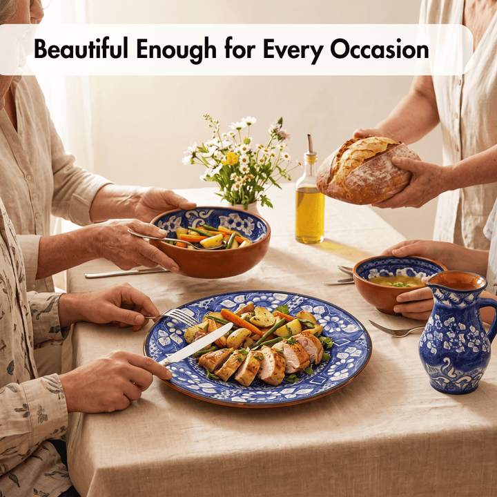 A warm dining scene with people serving and sharing food around a table set with blue-and-white ceramic dishes, including a plate of sliced grilled meat with vegetables, bowls, a pitcher, and a bottle of olive oil. A banner at the top reads, &