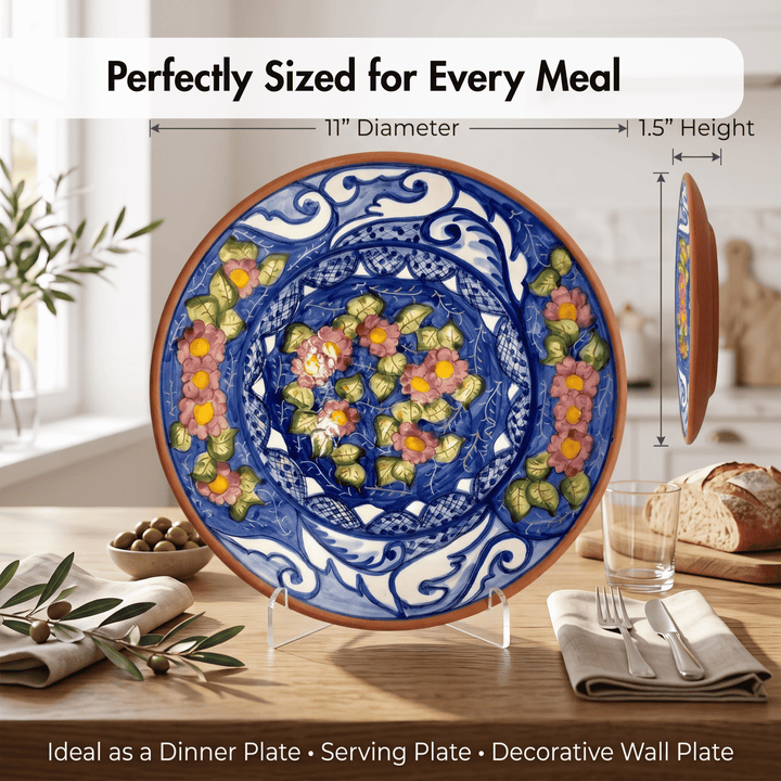 A large decorative ceramic dinner plate with a blue and white floral pattern and colorful fruit motifs, shown on a dining table with measurement callouts indicating 11-inch diameter and 1.5-inch height.