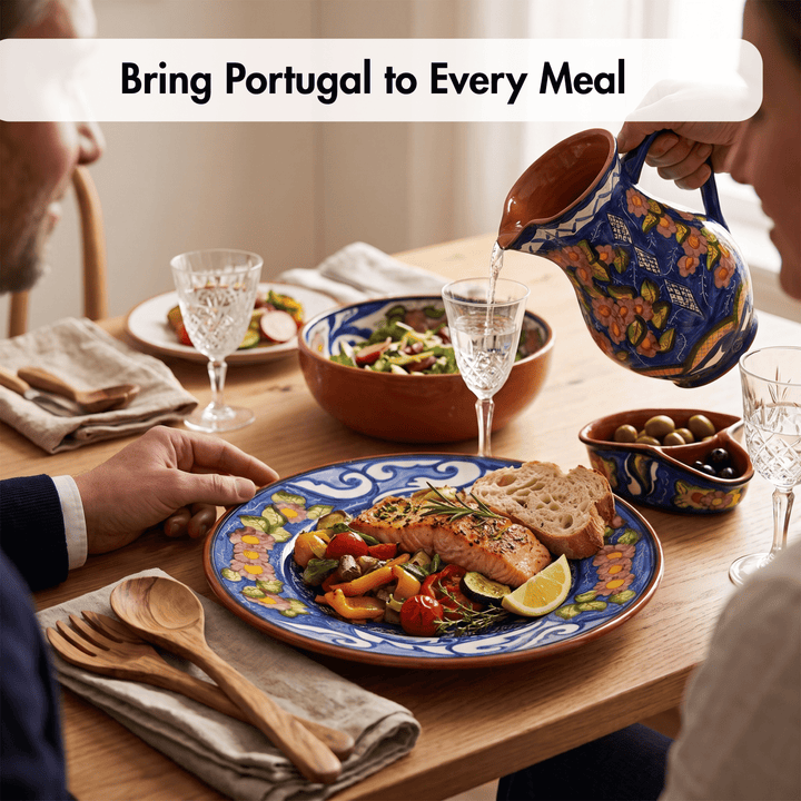 A lifestyle dining scene shows a person pouring water from a colorful hand-painted ceramic pitcher into glasses on a wooden table. A plated salmon meal with vegetables, bread, and olives is visible, along with the text overlay &