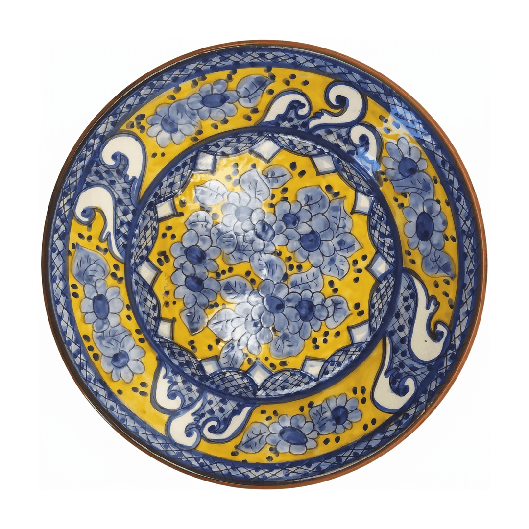 A round ceramic plate with a vibrant yellow background and intricate blue floral patterns, featuring a brown rim, photographed from directly above on a white background.