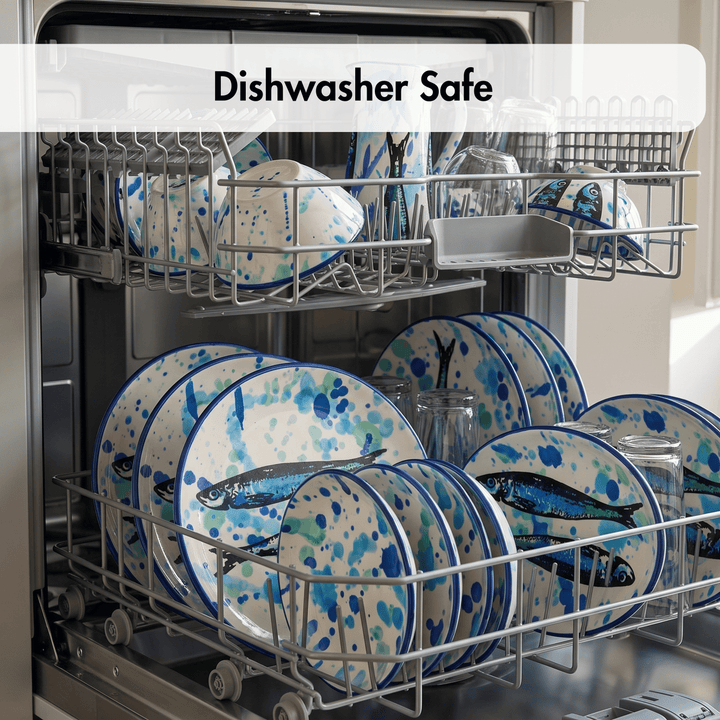 Open dishwasher with two racks loaded with blue and white patterned plates, bowls, and clear glassware. A white semi-transparent banner across the top reads &