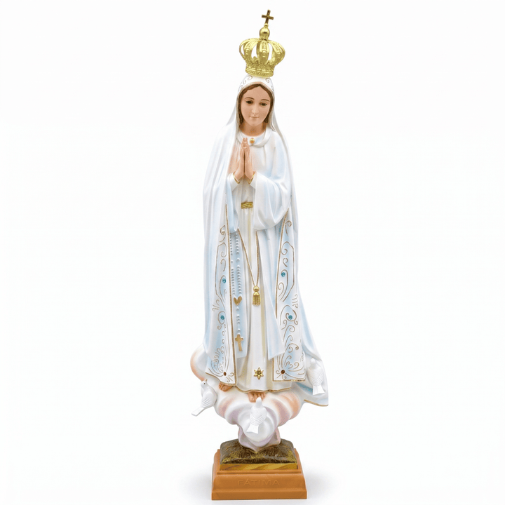 A religious figurine of the Virgin Mary standing on a cloud, wearing a white robe with gold and blue decorative details and a gold crown, mounted on a brown base against a white background.