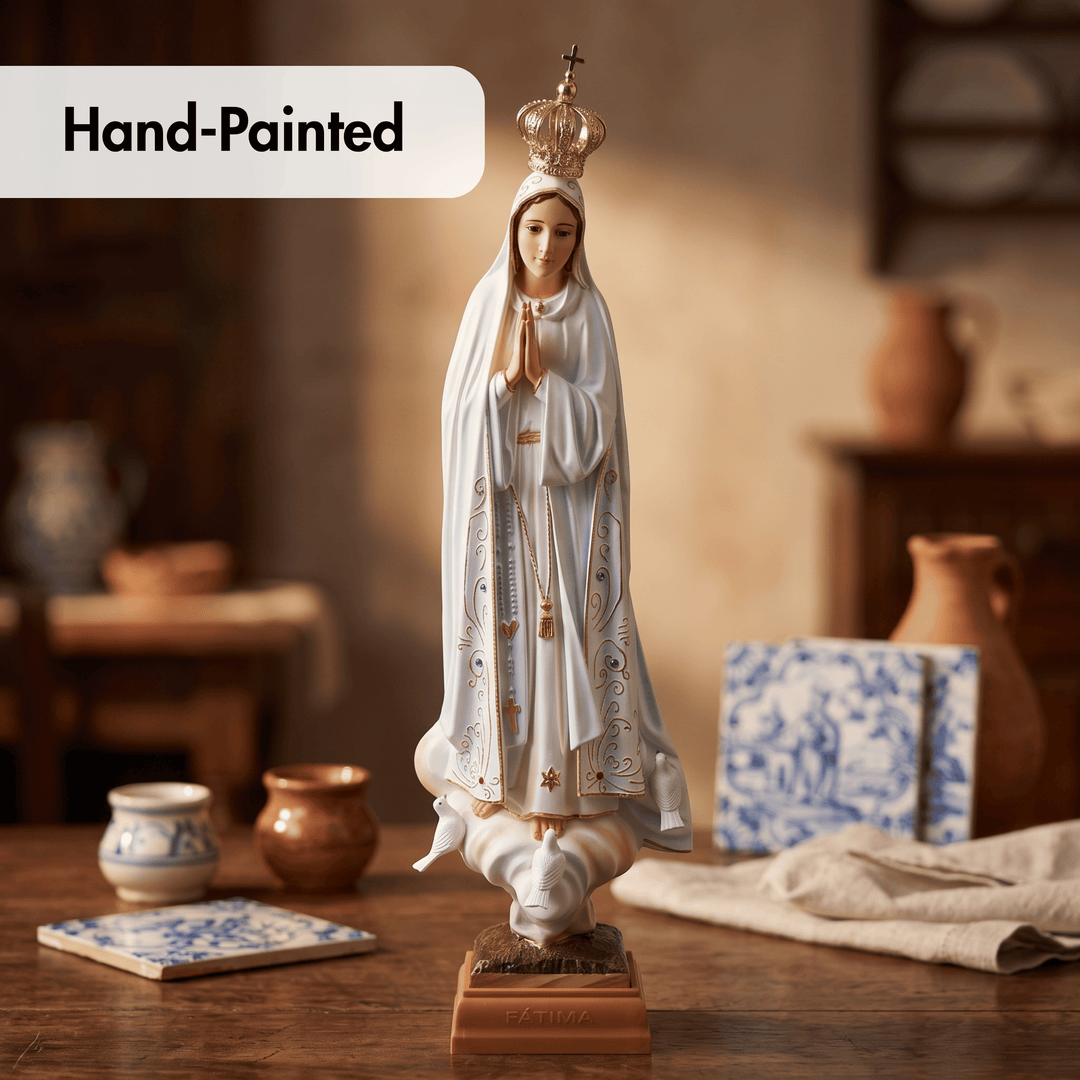 A hand-painted religious statue of the Virgin Mary standing on a base, shown on a rustic wooden table with decorative ceramic tiles and pottery in the background. A &