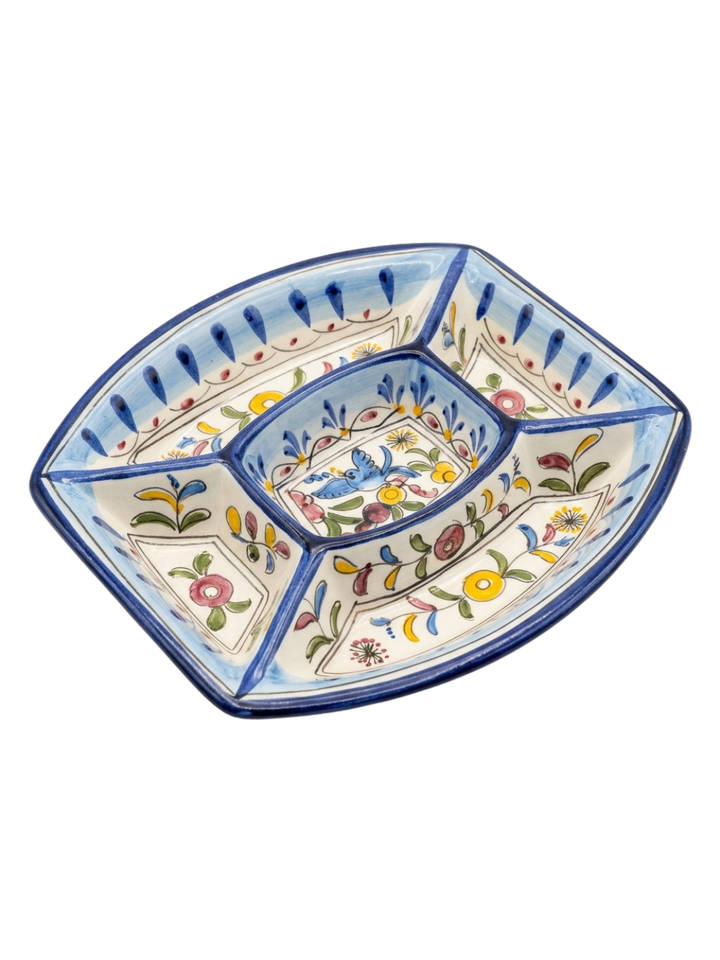 Decorative ceramic dish with floral patterns on a white background