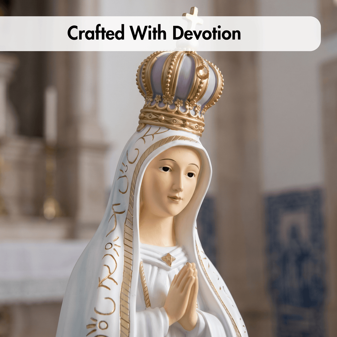 A devotional figurine of the Virgin Mary wearing a gold crown and white veil with gold detailing, shown against a softly blurred church interior. A white banner at the top reads &