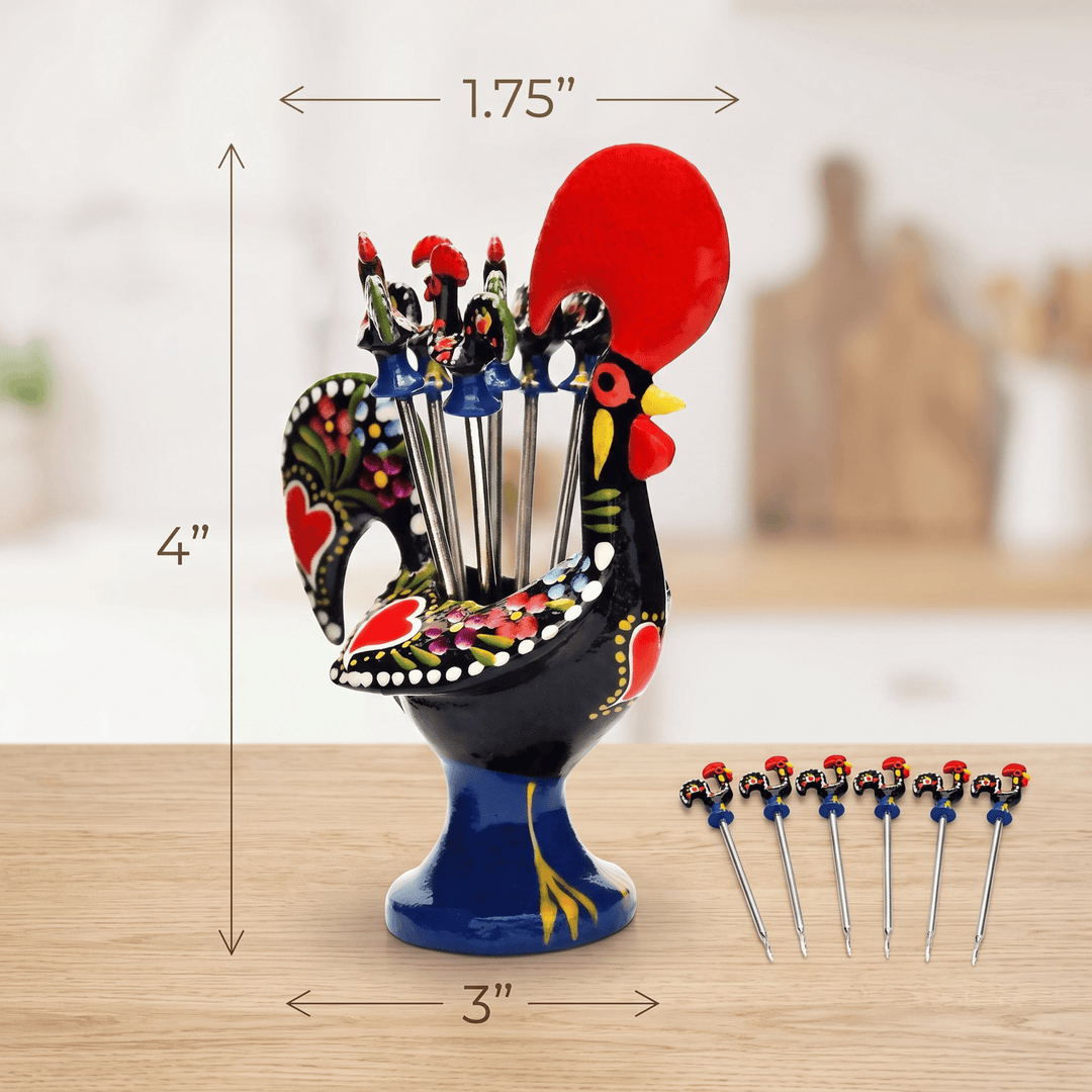 A decorative rooster-shaped utensil holder with colorful painted details, shown on a wooden surface with dimension arrows indicating 4 inches tall, 3 inches wide, and 1.75 inches at the top.