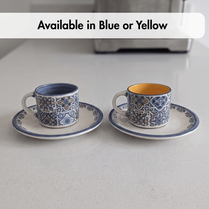 Two ceramic cups with saucers on a light gray surface, with text indicating color options.