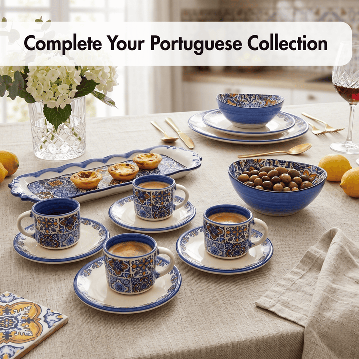Table setting with Portuguese-style blue and white ceramicware, including cups, saucers, and bowls.