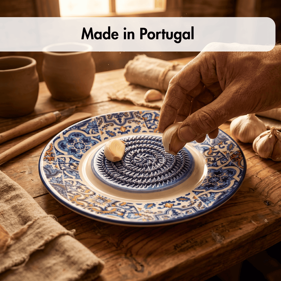 Handmade ceramic plate with intricate designs on a wooden table, featuring 'Made in Portugal' text.