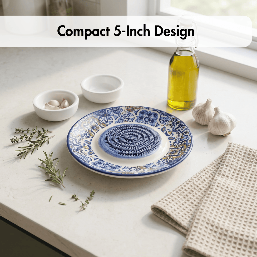 Blue and white decorative plate on a kitchen counter with oil and garlic