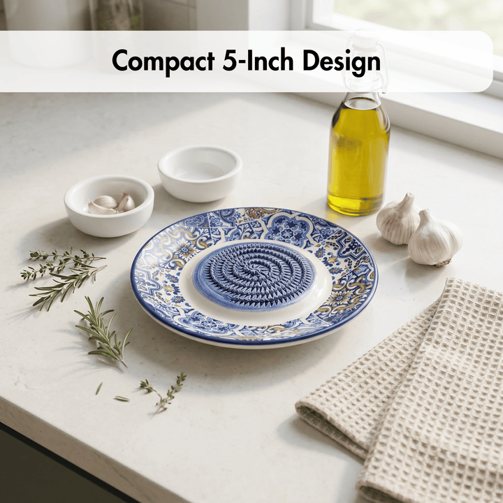Blue and white decorative plate on a kitchen counter with oil and garlic