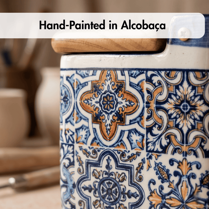 Ceramic pot with intricate blue and orange patterns, labeled 'Hand-Painted in Alcobaça'.