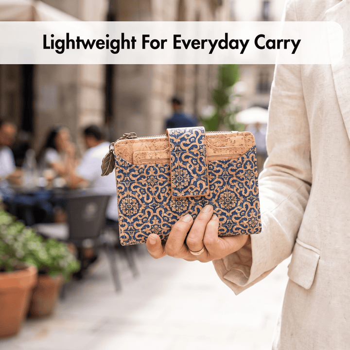 Person holding a patterned cork wallet with an outdoor setting in the background