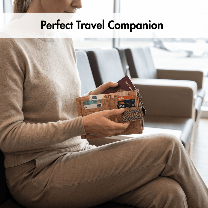 Person holding a cork wallet with cards in an airport setting, labeled 'Perfect Travel Companion'.