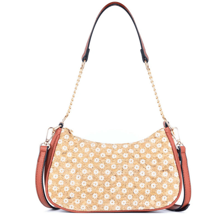 Beige cork handbag with white floral pattern on a white background