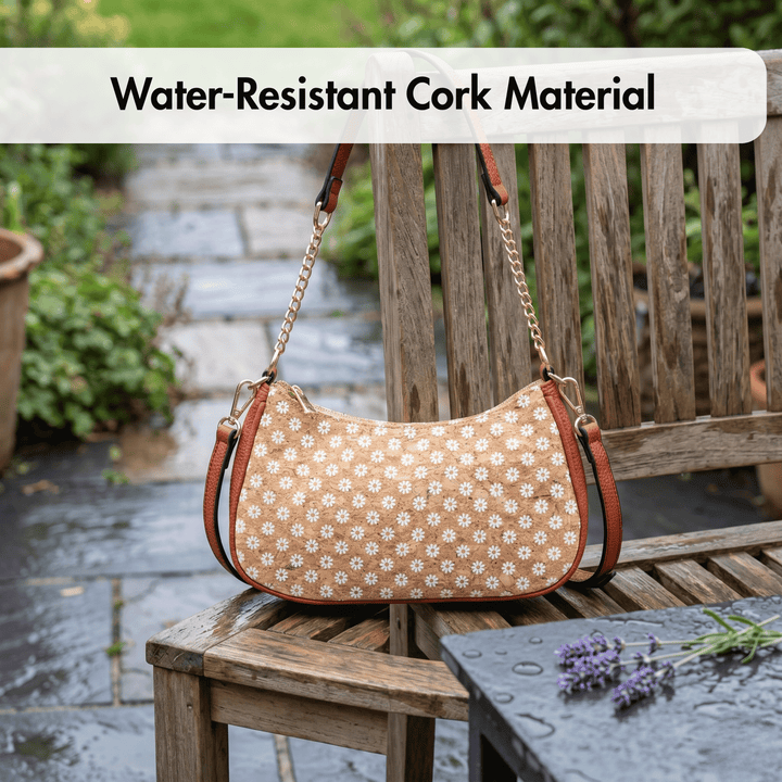 Floral-patterned handbag with water-resistant cork material on a wooden bench outdoors.