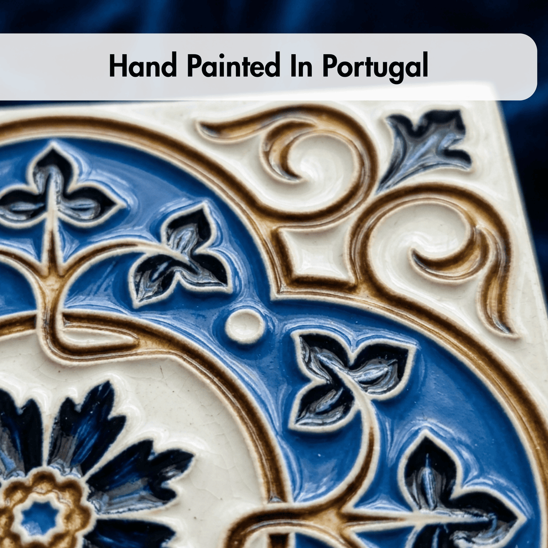 Decorative tile with intricate blue and gold patterns, labeled 'Hand Painted In Portugal'.