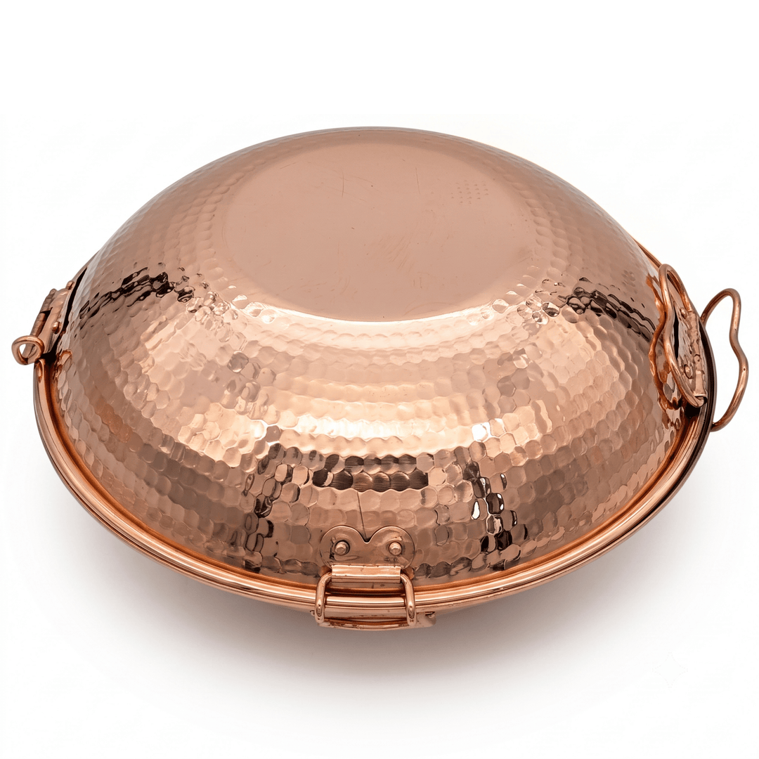 A hammered copper dome-shaped vessel, likely a decorative box or small cookware piece, shown on a clean white background.