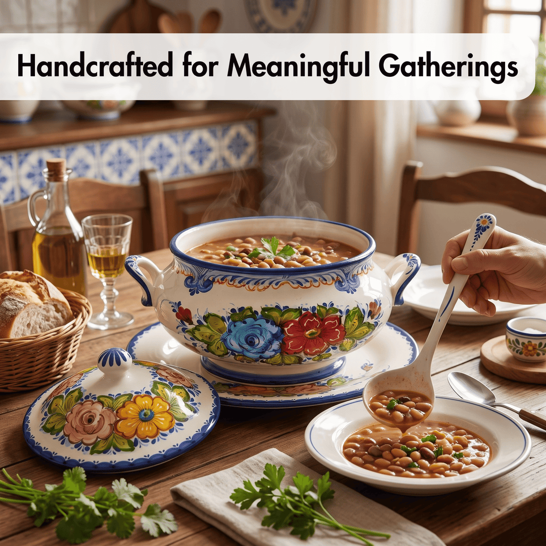 A hand holds a ladle over a bowl of soup in a warmly lit dining setting. The main product appears to be a decorative ceramic soup pot and matching lidded pot with floral hand-painted patterns, shown on a wooden table with bread, a glass, and other tableware.