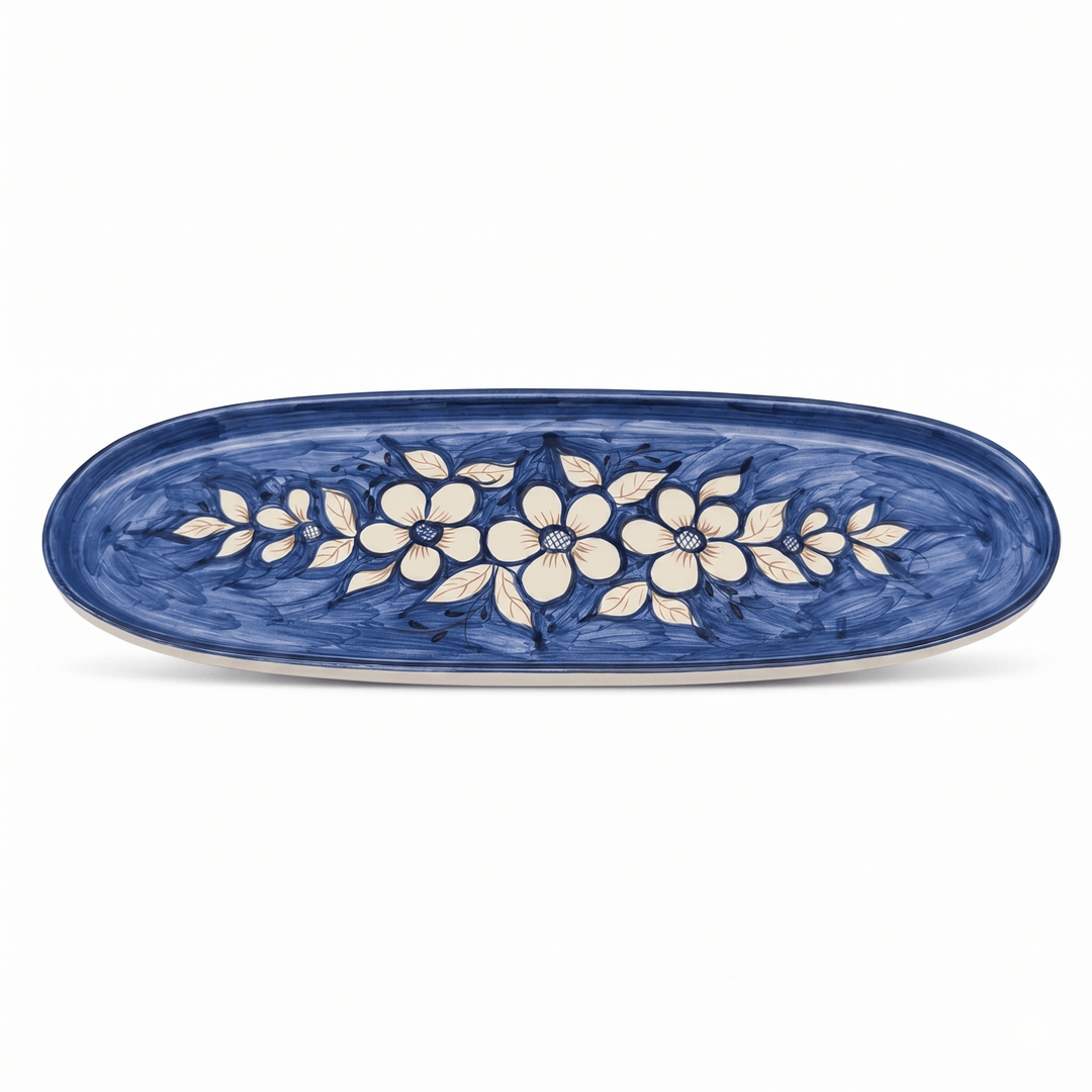 Oval ceramic platter with floral design on a white background