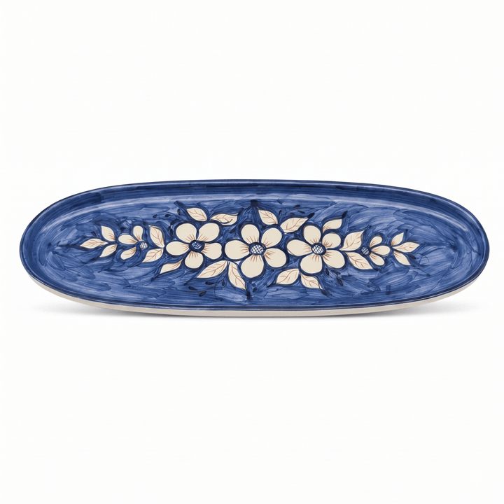 Oval ceramic platter with floral design on a white background