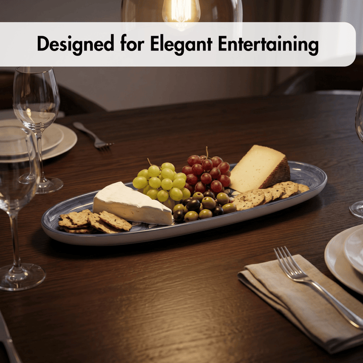 Platter of cheese, fruits, and crackers on a table with wine glasses and cutlery, labeled 'Designed for Elegant Entertaining'.