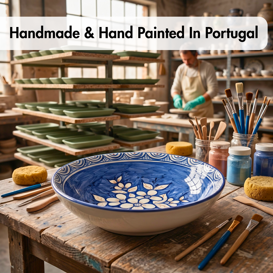 Handmade ceramic bowl with blue and white design in a pottery workshop.