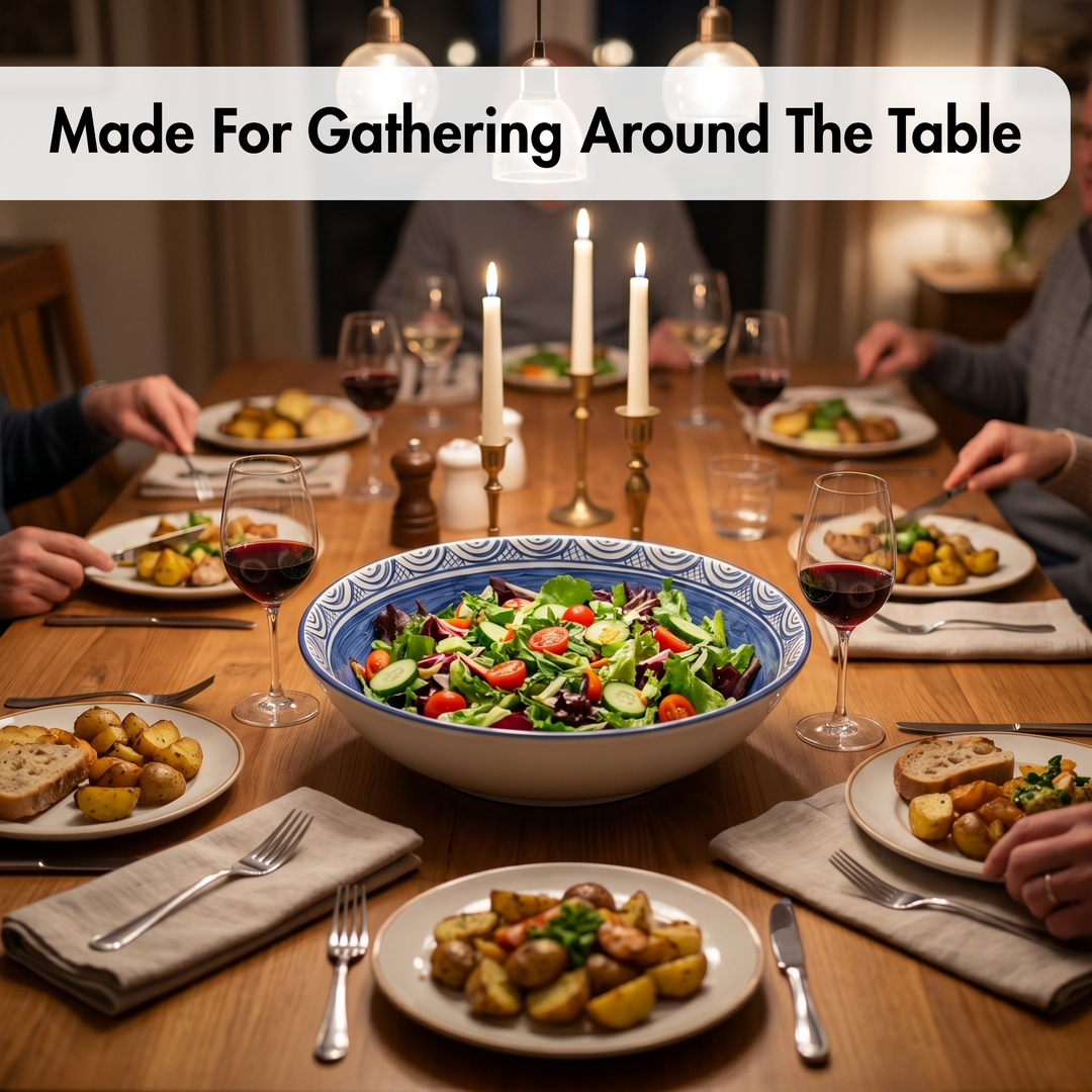 Dinner table setting with a large bowl of salad and people around the table, with text 'Made For Gathering Around The Table'.