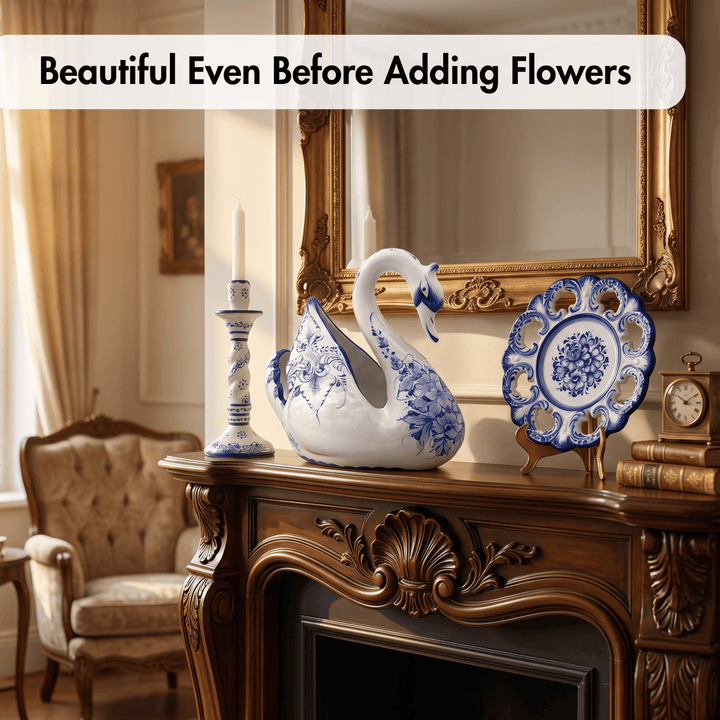 A decorative white ceramic swan figurine with blue floral patterns sits on an ornate dark wood mantel in a vintage room, alongside a blue-and-white plate, candlestick, mirror, and framed wall art. A text banner at the top reads, &