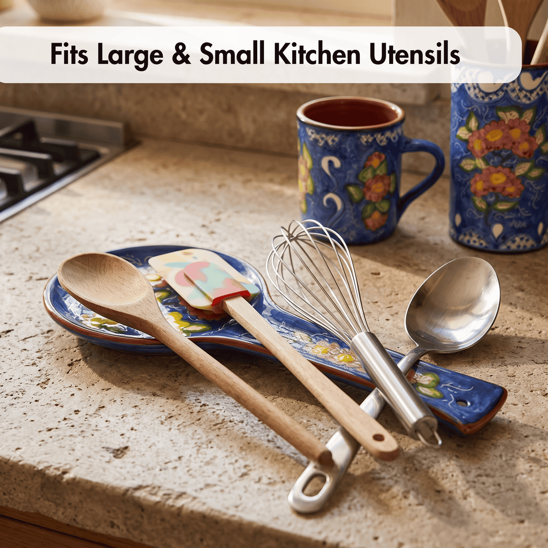 A set of kitchen utensils including a wooden spoon, silicone spatula, metal whisk, and stainless steel spoon resting on a blue floral ceramic dish on a granite countertop. A text overlay at the top reads &
