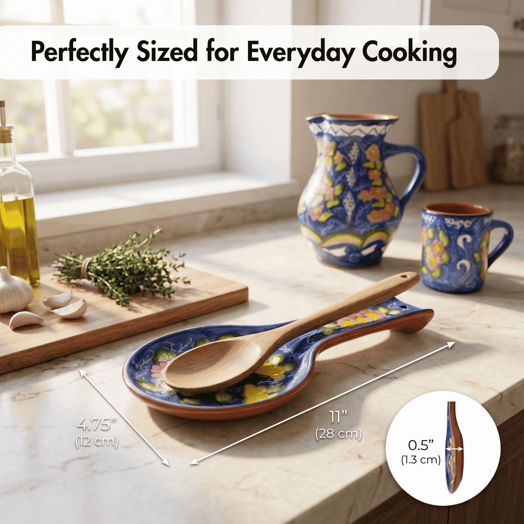 A ceramic spoon rest with a wooden spoon on top, shown on a kitchen countertop with other matching cookware nearby. White text at the top reads &