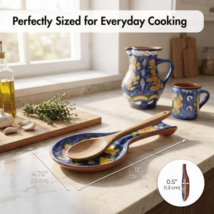 A ceramic spoon rest with a wooden spoon on top, shown on a kitchen countertop with other matching cookware nearby. White text at the top reads &