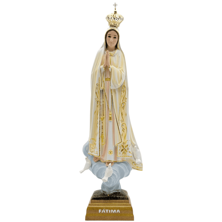 A religious figurine of Our Lady of Fatima standing on a cloud, wearing a white robe with gold trim and a gold crown, mounted on a gold base labeled &