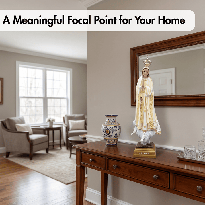 A religious statue of the Virgin Mary on a console table in a beautifully styled living room. The scene includes a blue and white ceramic vase, a large wood-framed mirror, and a white text banner at the top that reads &