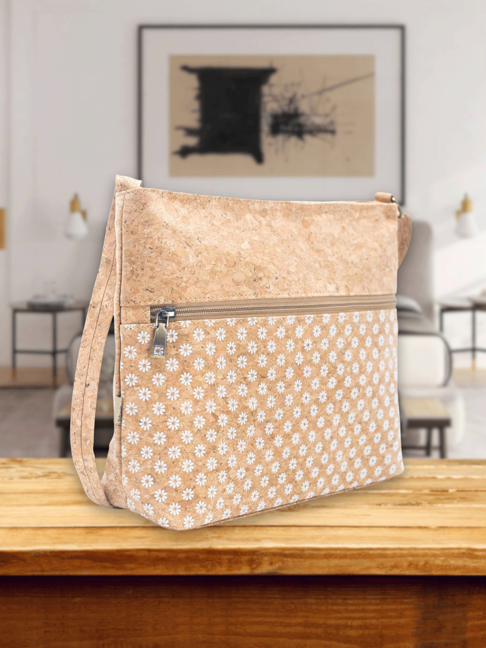 Stylish and eco-friendly cork shoulder bag crafted from natural Portuguese cork. Features adjustable strap, floral embellishments, and convenient pockets. Ideal for sustainable fashion enthusiasts.