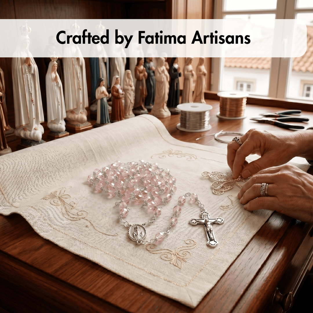 Person working on a rosary with embroidered cloth, surrounded by religious statues, in a workshop setting.