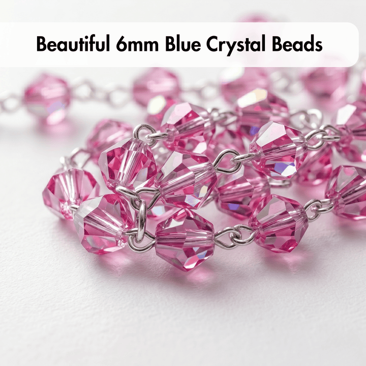 Close-up of pink crystal beads with silver chain on a white background